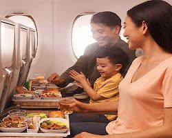 Family eating snacks on a plane